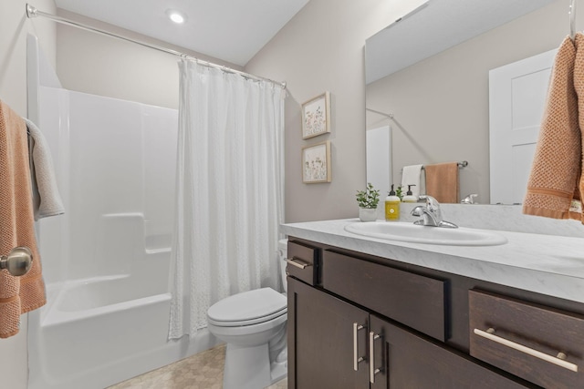 bathroom with toilet, shower / tub combo, and vanity