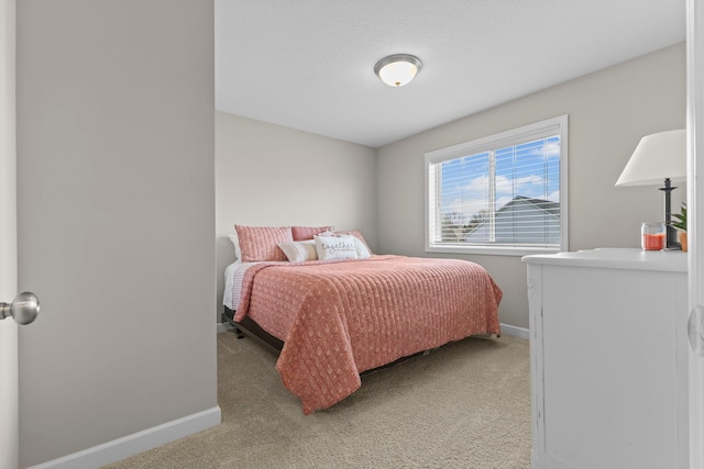 carpeted bedroom with baseboards