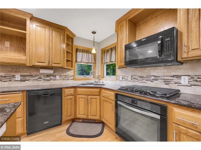 kitchen featuring decorative backsplash, open shelves, a sink, black appliances, and dark stone counters