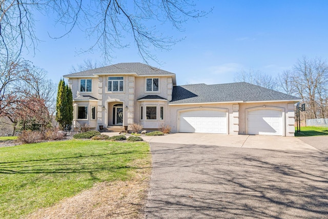 traditional-style home featuring concrete driveway, stucco siding, a front lawn, and a garage