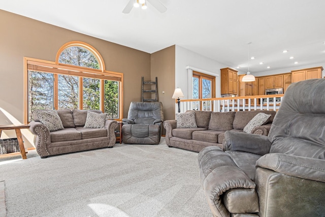 carpeted living room with a ceiling fan and recessed lighting