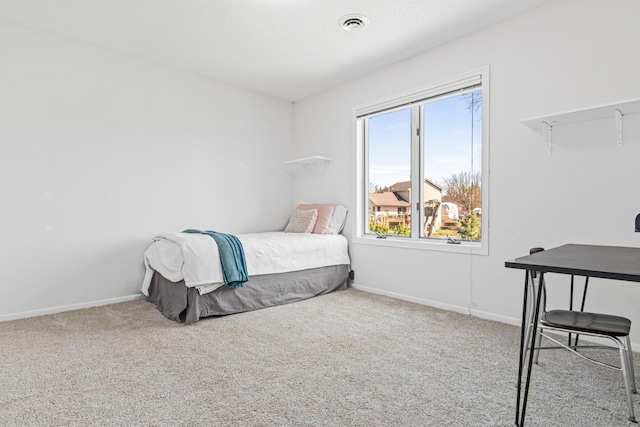 bedroom featuring carpet floors and baseboards