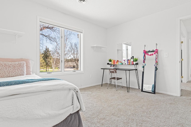 bedroom with baseboards, carpet flooring, and visible vents