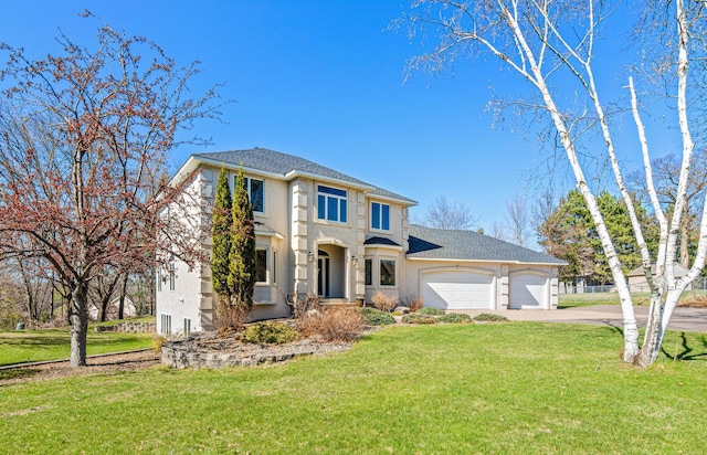 view of front of house featuring a front lawn, concrete driveway, an attached garage, a shingled roof, and stucco siding