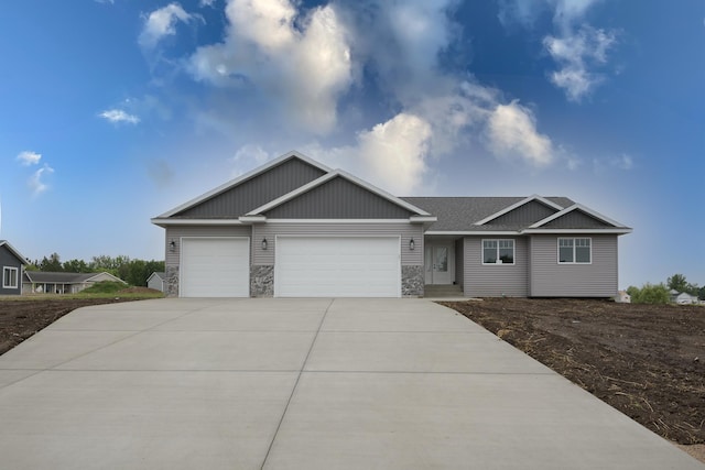 LOT4 Wilderness Ridge Rd SE, Alexandria Twp, MN 56308 - single story home with board and batten siding, driveway, stone siding, and a garage