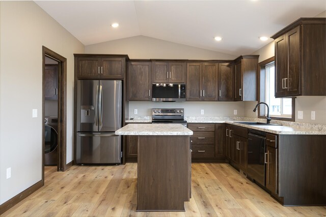 LOT4 Wilderness Ridge Rd SE, Alexandria Twp, MN 56308 - kitchen with dark brown cabinetry, a kitchen island, vaulted ceiling, a sink, and stainless steel appliances