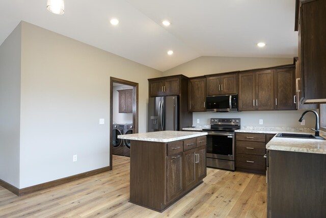 LOT4 Wilderness Ridge Rd SE, Alexandria Twp, MN 56308 - kitchen with a sink, washer and dryer, dark brown cabinets, and stainless steel appliances