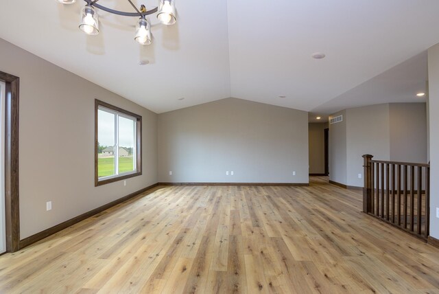 LOT4 Wilderness Ridge Rd SE, Alexandria Twp, MN 56308 - spare room with visible vents, light wood finished floors, lofted ceiling, and an inviting chandelier