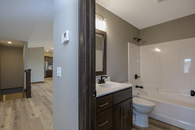 LOT4 Wilderness Ridge Rd SE, Alexandria Twp, MN 56308 - full bathroom with washtub / shower combination, vanity, toilet, and wood finished floors