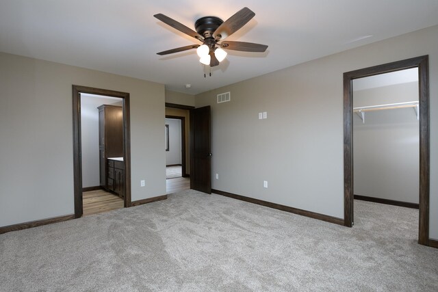 LOT4 Wilderness Ridge Rd SE, Alexandria Twp, MN 56308 - unfurnished bedroom featuring baseboards, visible vents, a walk in closet, and carpet