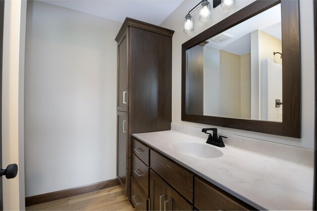 LOT4 Wilderness Ridge Rd SE, Alexandria Twp, MN 56308 - bathroom with vanity, baseboards, and wood finished floors