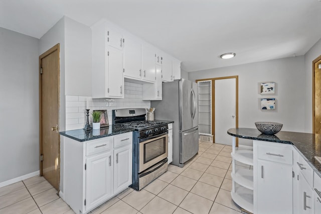 kitchen with open shelves, light tile patterned floors, white cabinets, and stainless steel appliances