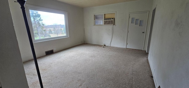 carpeted spare room with visible vents