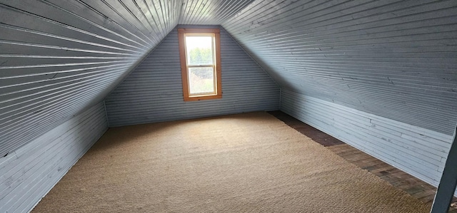 bonus room featuring wood walls, wood ceiling, and lofted ceiling