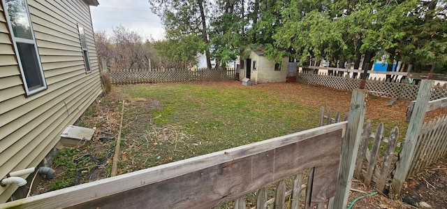 view of yard with a fenced backyard