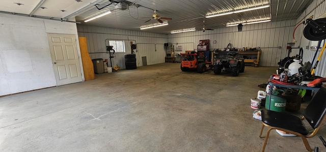 garage with a ceiling fan and a garage door opener