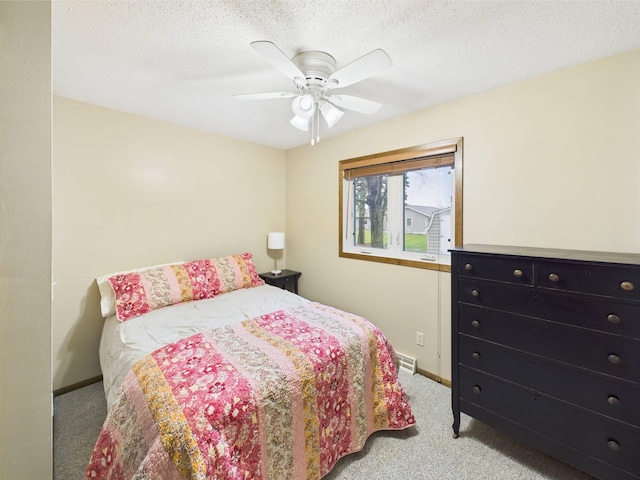 bedroom featuring baseboards, ceiling fan, and carpet flooring
