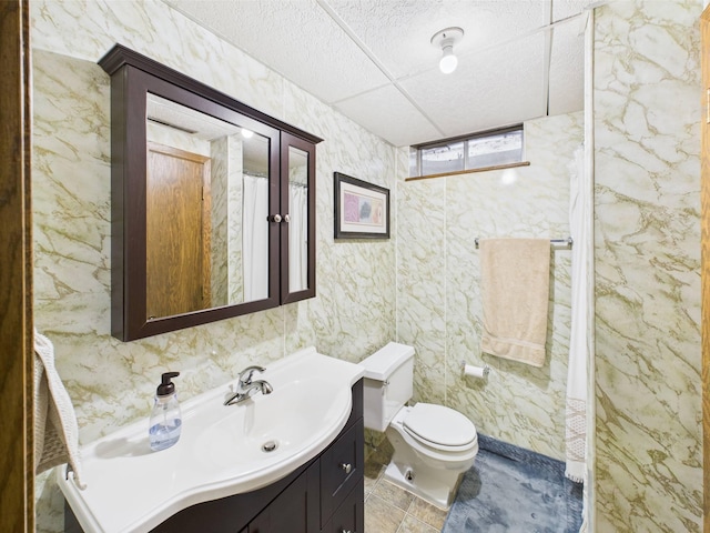 full bathroom featuring vanity and toilet