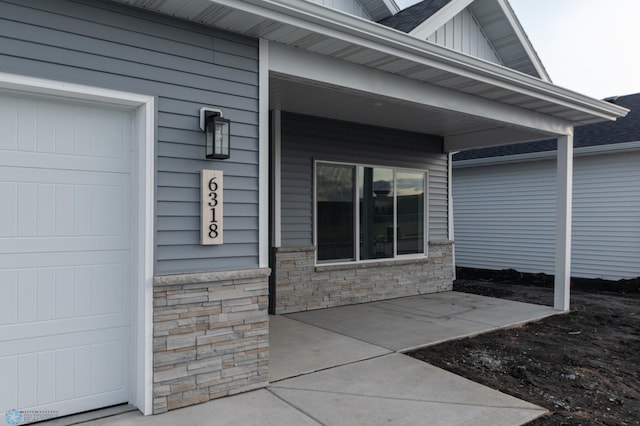 doorway to property featuring stone siding