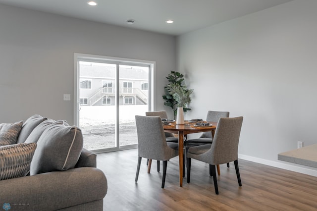 dining room featuring recessed lighting, baseboards, and wood finished floors