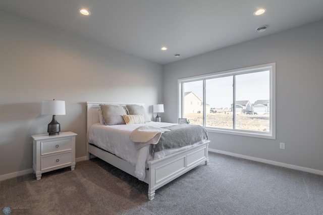 bedroom with recessed lighting, baseboards, and dark colored carpet