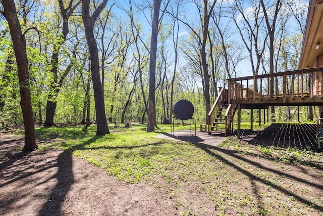 view of yard featuring stairway and a deck