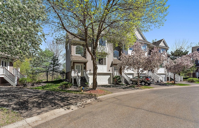 townhome / multi-family property featuring stairway and a residential view