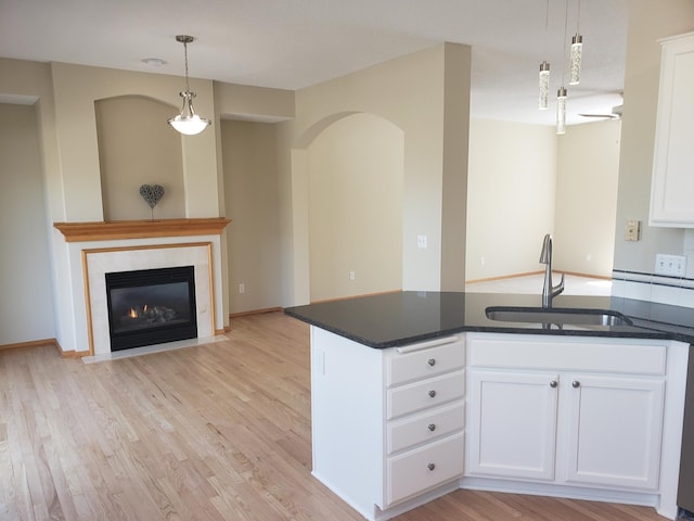 886 Trenton Ln N, Plymouth, MN 55441 - kitchen featuring a sink, white cabinets, light wood-style flooring, and open floor plan