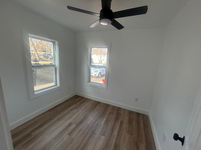 507 Peck St, Fergus Falls, MN 56537 - empty room featuring healthy amount of natural light, wood finished floors, and baseboards