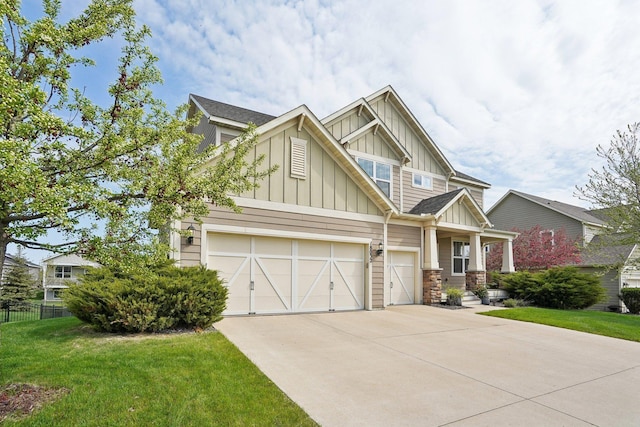craftsman house featuring board and batten siding and driveway
