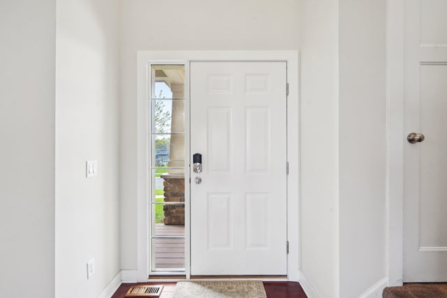 entryway featuring baseboards