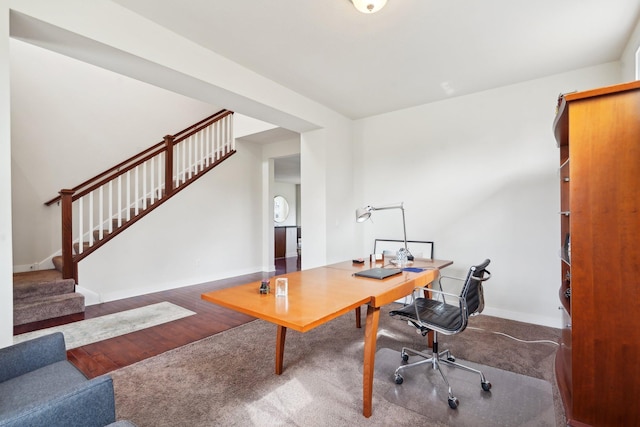office with wood finished floors and baseboards