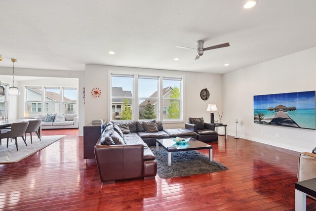 living area with hardwood / wood-style flooring, ceiling fan, recessed lighting, and baseboards