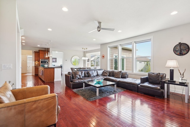 living room with dark wood-style flooring, ceiling fan, and recessed lighting