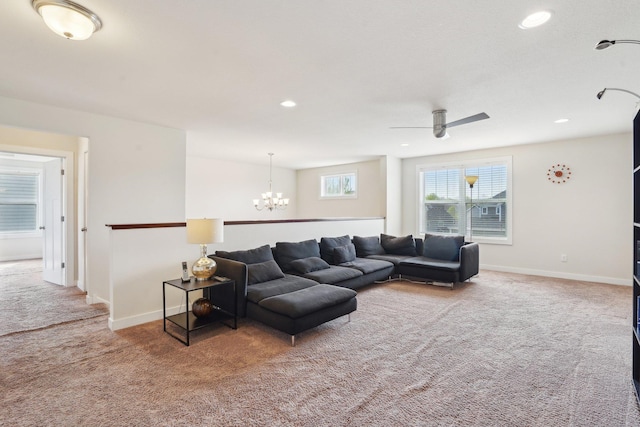 living room with carpet, a chandelier, baseboards, ceiling fan, and recessed lighting
