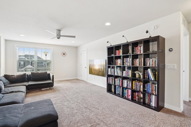 carpeted living area featuring ceiling fan, baseboards, and recessed lighting