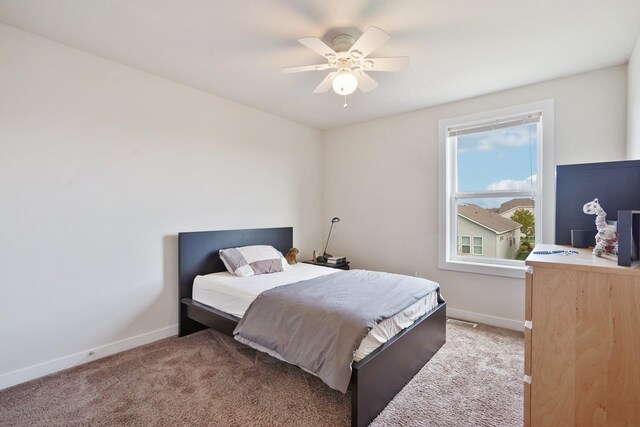 bedroom with baseboards, light carpet, and a ceiling fan