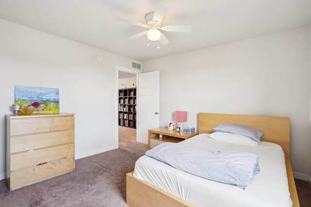 carpeted bedroom featuring a ceiling fan and baseboards