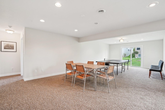 dining space with light colored carpet, recessed lighting, and baseboards