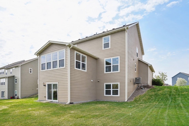 rear view of house with a lawn
