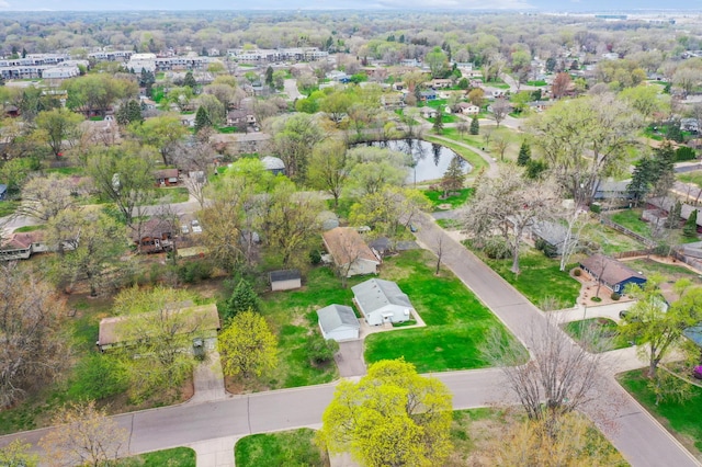 drone / aerial view with a residential view and a water view