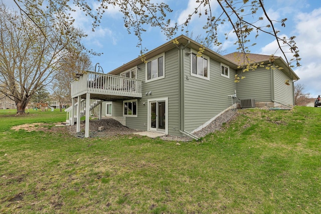back of house featuring central AC unit, a yard, and a deck