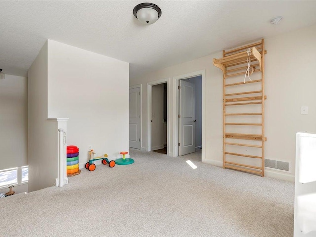 recreation room featuring visible vents and carpet floors