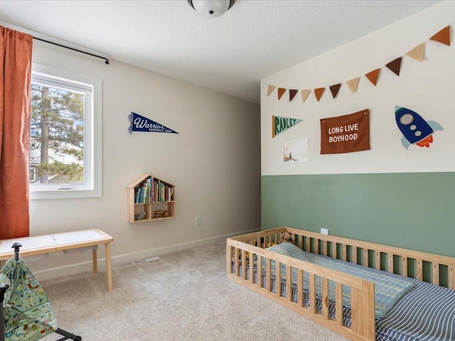 bedroom with baseboards and carpet