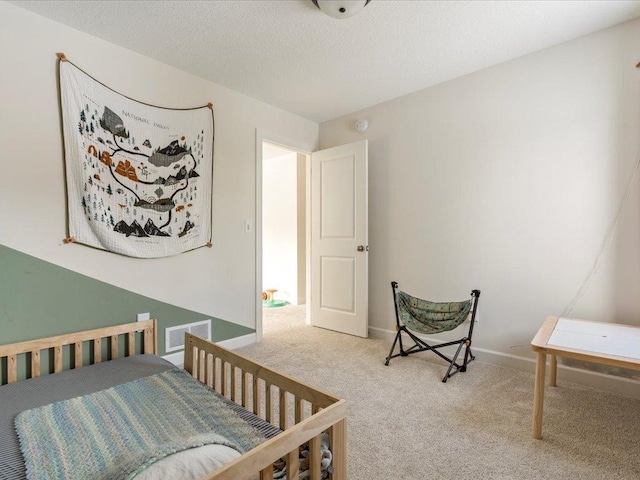 bedroom featuring visible vents, carpet flooring, and baseboards