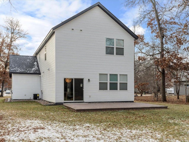 rear view of house with a yard, a patio, and cooling unit