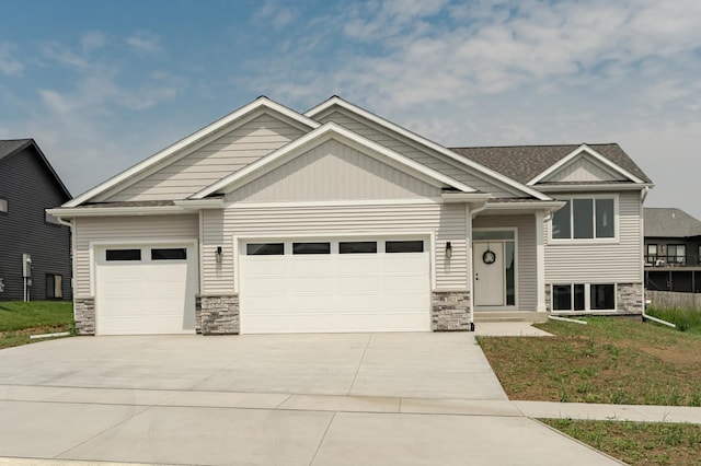 1812 Brandt Dr NE, Byron, MN 55920 - craftsman-style house featuring an attached garage, stone siding, and driveway