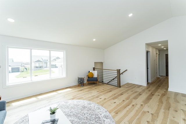 1812 Brandt Dr NE, Byron, MN 55920 - spare room with lofted ceiling, light wood-type flooring, and recessed lighting