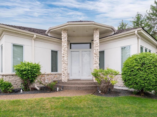 2673 Cedar Grn, Minnetonka, MN 55305 - property entrance with a yard, stucco siding, and stone siding