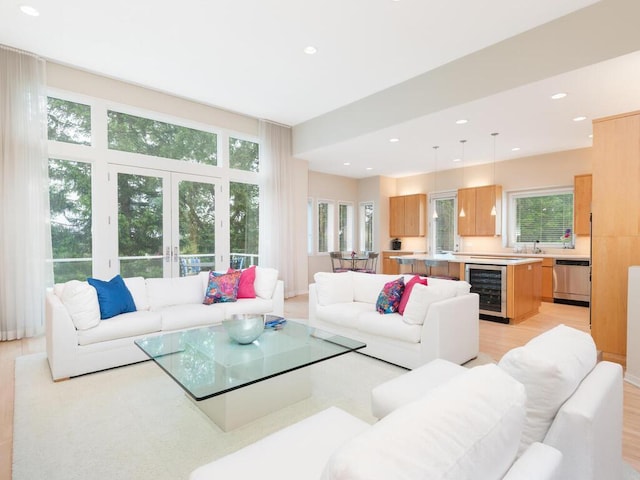 2673 Cedar Grn, Minnetonka, MN 55305 - living room with beverage cooler, recessed lighting, french doors, and light wood finished floors